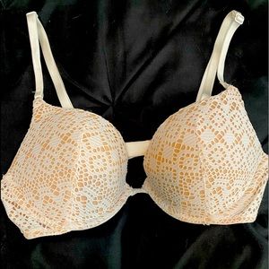 Victoria’s Secret push up bra. White/nude, eye hook back closure. Size 36B.